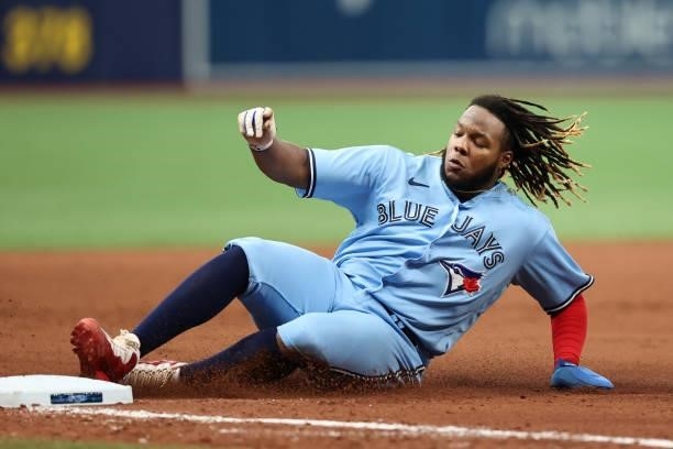 Vladimir Guerrero Jr. #27 of the Toronto Blue Jays slides into third in the eight inning during the game between the Toronto Blue Jays and the Tampa...