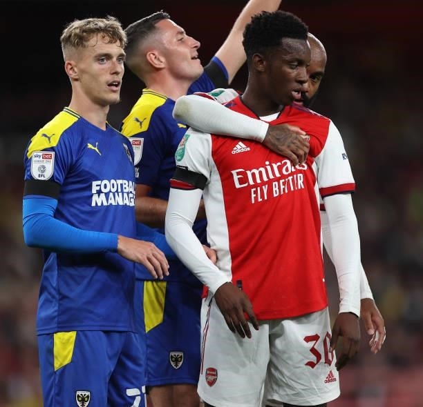 Alexandre Lacazette of Arsenal peers round Eddie Nketiah during the Carabao Cup Third Round match between Arsenal and AFC Wimbledon at Emirates...