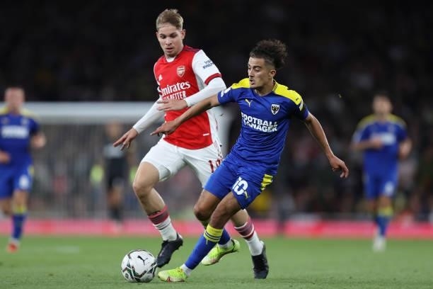 Emile Smith Rowe of Arsenal and Ayoub Assal of AFC Wimbledon during the Carabao Cup Third Round match between Arsenal and AFC Wimbledon at Emirates...