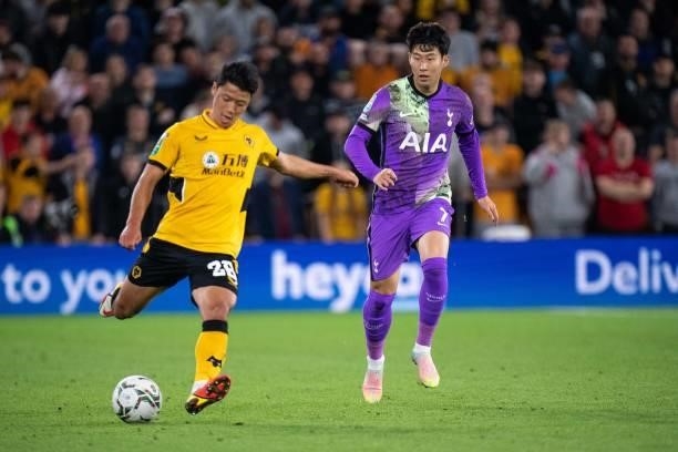 Hee Chan Hwang,of Wolverhampton Wanderers and Son Heung-min of Tottenham Hotspur in action during the Carabao Cup Third Round match between...