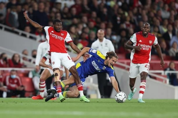 Ainsley Maitland-Niles of Arsenal and Aaron Pressley of AFC Wimbledon during the Carabao Cup Third Round match between Arsenal and AFC Wimbledon at...