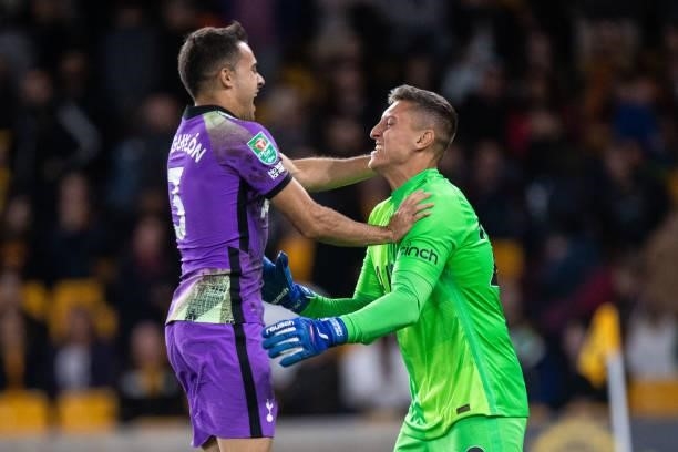Pierluigi Gollini of Tottenham Hotspur celebrate with Sergio Reguilón during the Carabao Cup Third Round match between Wolverhampton Wanderers and...
