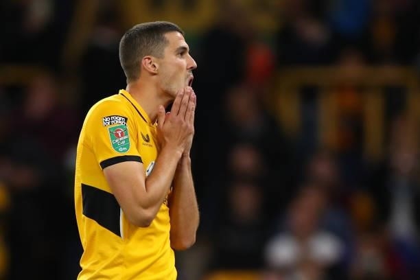 Conor Coady of Wolverhampton Wanderers reacts after missing the decisive penalty during the Carabao Cup Third Round match between Wolverhampton...