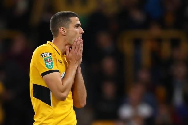 Conor Coady of Wolverhampton Wanderers reacts after missing the decisive penalty during the Carabao Cup Third Round match between Wolverhampton...