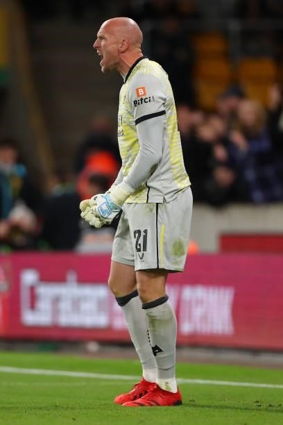 John Ruddy of Wolverhampton Wanderers reacts after saving a penalty during the shoot out during the Carabao Cup Third Round match between...