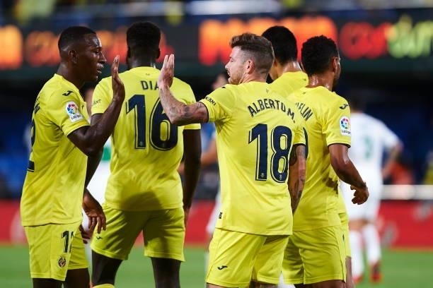Players of Villarreal celebrate after his team mate Alberto Moreno of FC Villarreal scored the fourth goal during the LaLiga Santander match between...