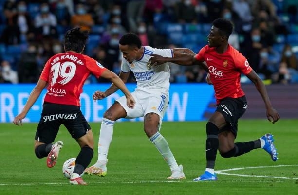 Eder Militao of Real Madrid CF, Kang in Lee of RCD Mallorca and Lago Junior of RCD Mallorca battle for the ball during the LaLiga Santander match...