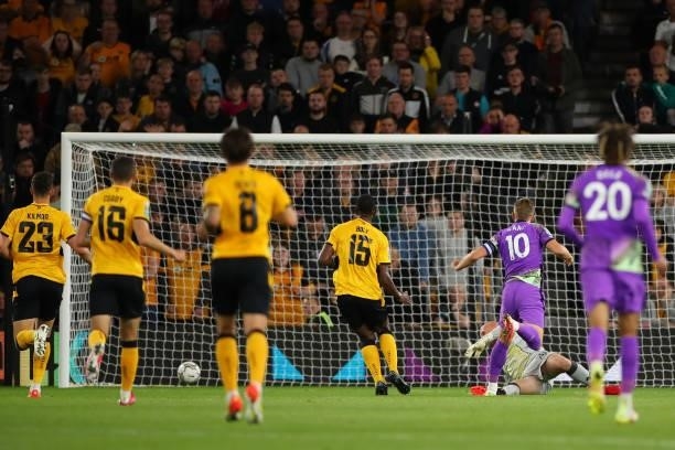 Harry Kane of Tottenham Hotspur scores a goal to make it 0-2 during the Carabao Cup Third Round match between Wolverhampton Wanderers and Tottenham...