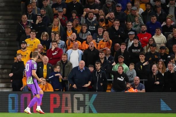 Fans of Wolverhampton Wanderers react as Harry Kane of Tottenham Hotspur celebrates after scoring a goal to make it 0-2 during the Carabao Cup Third...