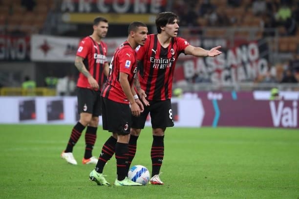 Ismael Bennacer of AC Milan and Sandro Tonali gestures during the Serie A match between AC Milan and Venezia FC at Stadio Giuseppe Meazza on...
