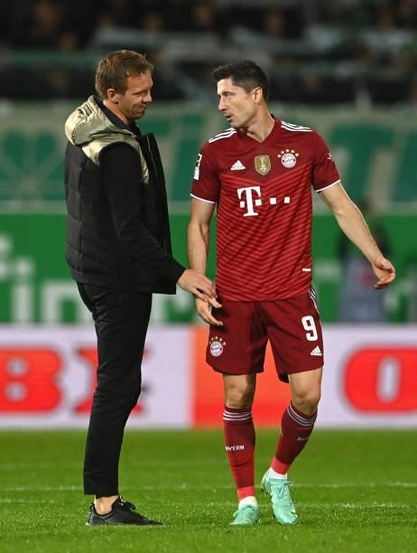 Bayern Munich's headcoach Julian Nagelsmann and Bayern Munich's Polish striker Robert Lewandowski speak after the German first division Bundesliga...