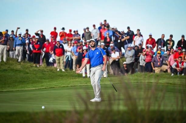 Jon Rahm of Spain and Team Europe reacts to missing a putt on the 14th hole green during Friday Afternoon Four-ball Matches of the 43rd Ryder Cup at...