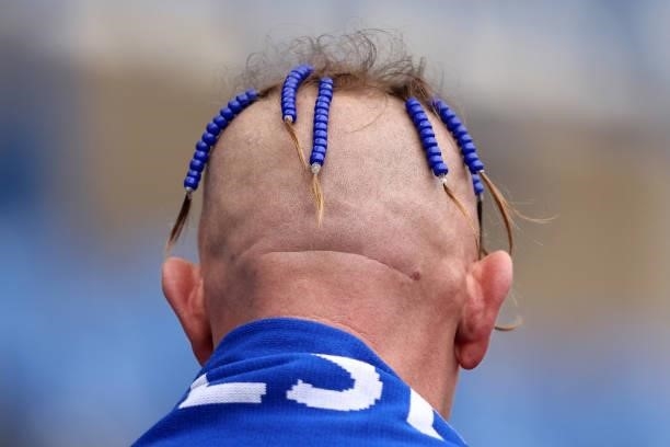 Chelsea fan with beaded hair is seen prior to the Premier League match between Chelsea and Manchester City at Stamford Bridge on September 25, 2021...