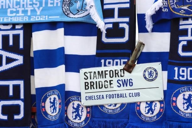 Replica road sign for Stamford Bridge SW6 for sale amongst Chelsea scarves ahead of the Premier League match between Chelsea and Manchester City at...