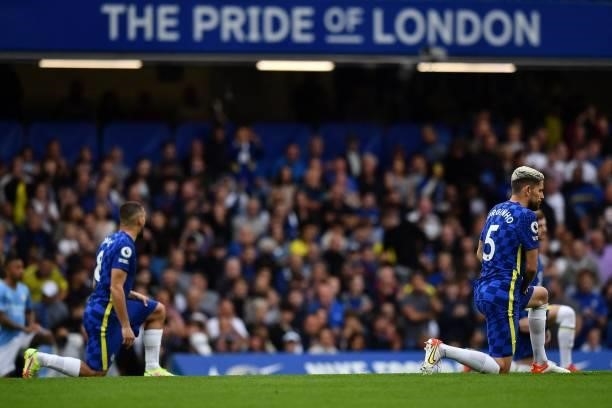 Chelsea's Italian midfielder Jorginho takes the knee ahead of the English Premier League football match between Chelsea and Manchester City at...