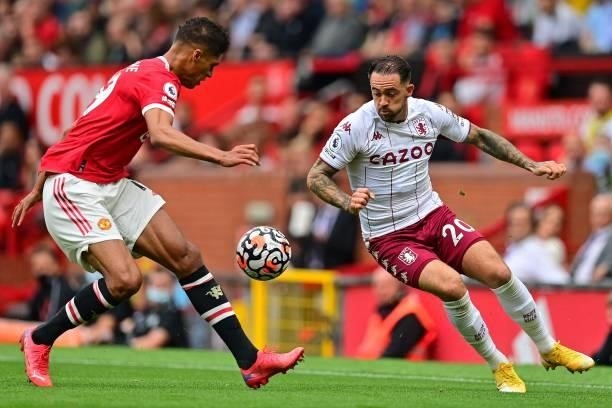 Manchester United's French defender Raphael Varane vies with Aston Villa's English striker Danny Ings during the English Premier League football...