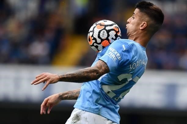 Manchester City's Portuguese defender Joao Cancelo controls the ball during the English Premier League football match between Chelsea and Manchester...