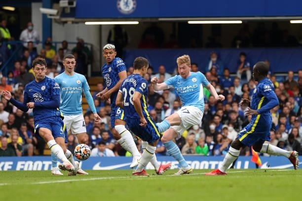 Kevin De Bruyne of Manchester City has a shot blocked by Andreas Christensen of Chelsea during the Premier League match between Chelsea and...