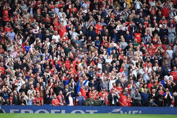 Manchester United fans rue a missed opportunity during the Premier League match between Manchester United and Aston Villa at Old Trafford on...