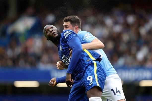 Romelu Lukaku of Chelsea heads the ball away from Aymeric Laporte of Man City during the Premier League match between Chelsea and Manchester City at...