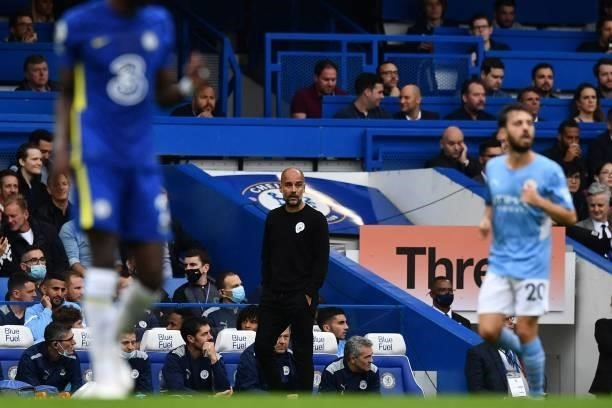 Manchester City's Spanish manager Pep Guardiola gestures from the side-lines during the English Premier League football match between Chelsea and...