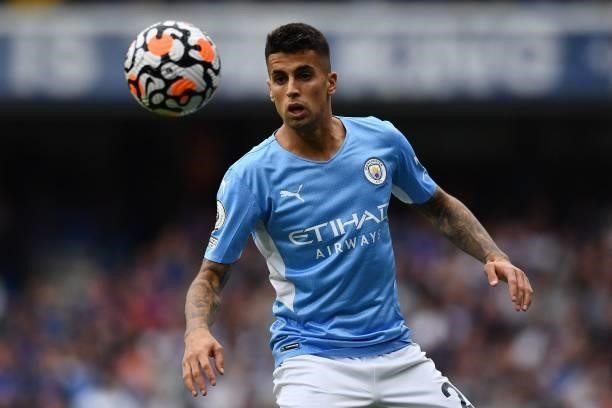 Manchester City's Portuguese defender Joao Cancelo controls the ball during the English Premier League football match between Chelsea and Manchester...