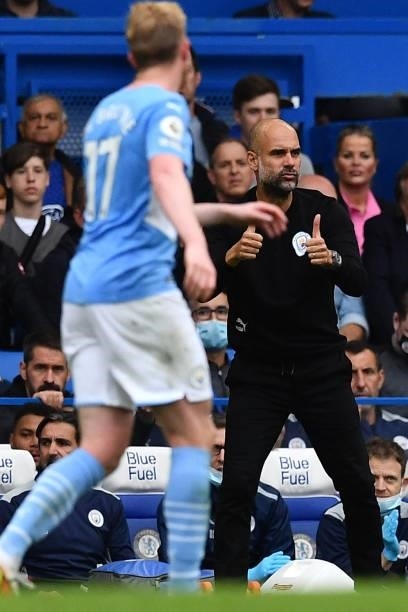 Manchester City's Spanish manager Pep Guardiola gestures from the side-lines during the English Premier League football match between Chelsea and...