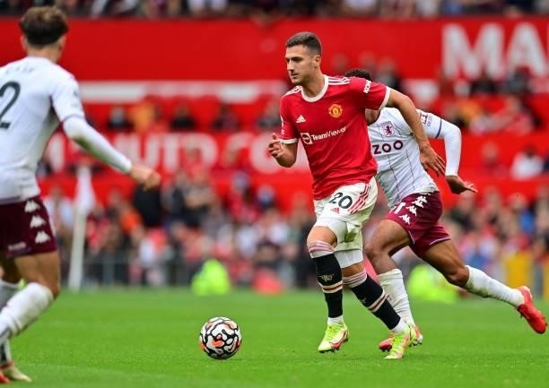 Manchester United's Portuguese defender Diogo Dalot runs with the ball during the English Premier League football match between Manchester United and...