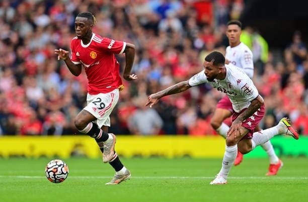 Manchester United's English defender Aaron Wan-Bissaka outruns Aston Villa's Brazilian midfielder Douglas Luiz during the English Premier League...