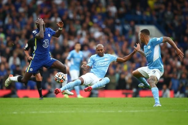 Antonio Rudiger of Chelsea in action with Fernandinho and Gabriel Jesus of Manchester City during the Premier League match between Chelsea and...