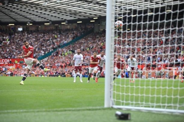 Bruno Fernandes of Manchester United strikes his penalty over the bar during the Premier League match between Manchester United and Aston Villa at...