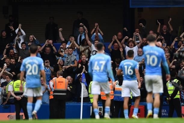 Manchester City's fans react at the final whistle during the English Premier League football match between Chelsea and Manchester City at Stamford...