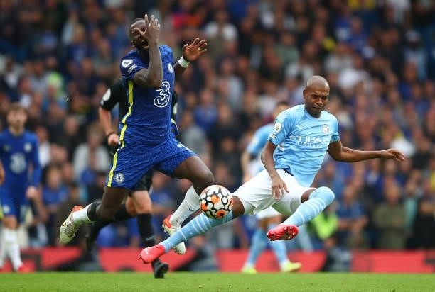Antonio Rudiger of Chelsea in action with Fernandinho of Manchester City during the Premier League match between Chelsea and Manchester City at...