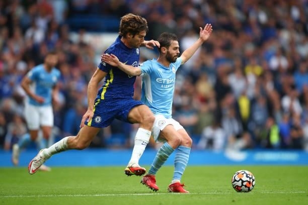 Bernardo Silva of Manchester City in action with Marcos Alonso of Chelsea during the Premier League match between Chelsea and Manchester City at...