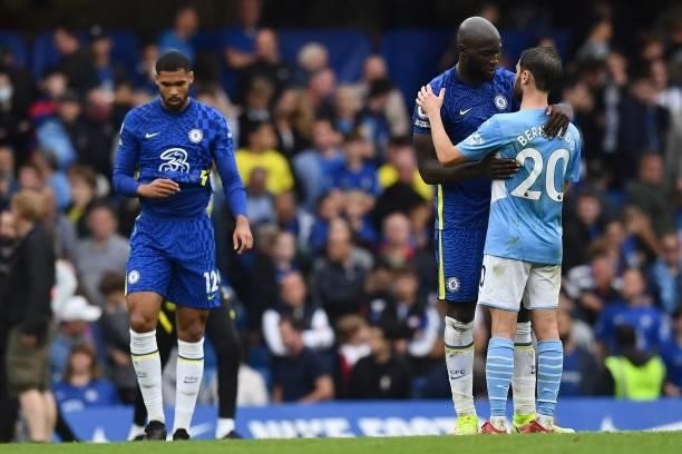Chelsea's Belgian striker Romelu Lukaku and Manchester City's Portuguese midfielder Bernardo Silva react at the final whistle during the English...