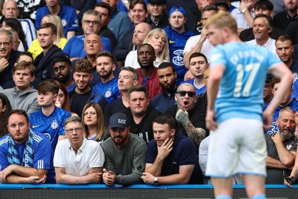 Chelsea fan with face tattoos makes the wanker sign at Kevin de Bruyne of Man City as he steps up to take a corner kick during the Premier League...