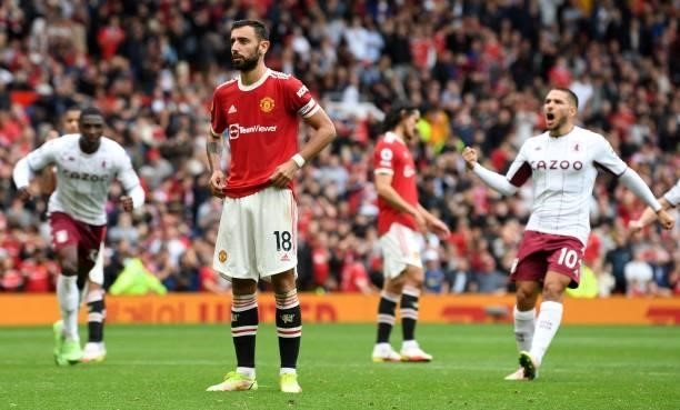 Manchester United's Portuguese midfielder Bruno Fernandes reacts after failing to score a penalty during the English Premier League football match...