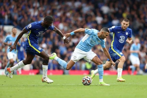 Riyad Mahrez of Man City is pursued by Antonio Rudiger of Chelsea during the Premier League match between Chelsea and Manchester City at Stamford...