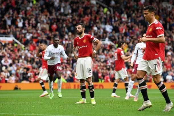 Manchester United's Portuguese midfielder Bruno Fernandes reacts after failing to score a penalty during the English Premier League football match...