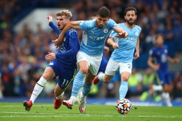Timo Werner of Chelsea tangles with Ruben Dias of Manchester City during the Premier League match between Chelsea and Manchester City at Stamford...