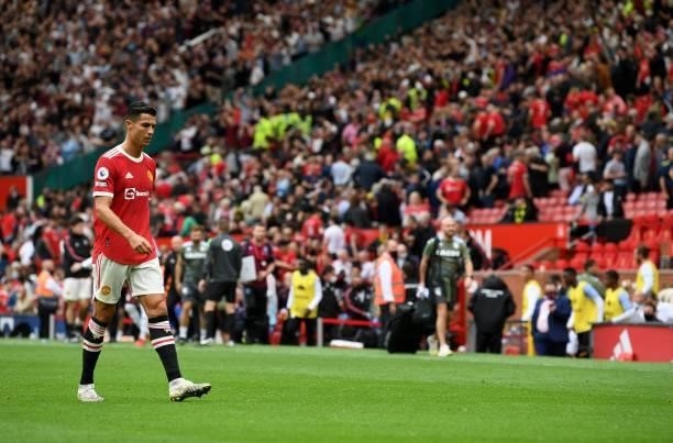 Manchester United's Portuguese striker Cristiano Ronaldo walks off of the pitch after the final whitle during the English Premier League football...