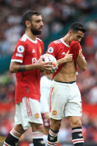 Cristiano Ronaldo of Manchester United looks dejected as Bruno Fernandes of Manchester United prepares to take a penalty during the Premier League...