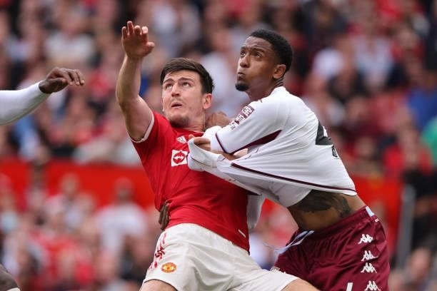 Ezri Konsa of Aston Villa pulls down Harry Maguire of Manchester United but no penalty was awarded during the Premier League match between Manchester...
