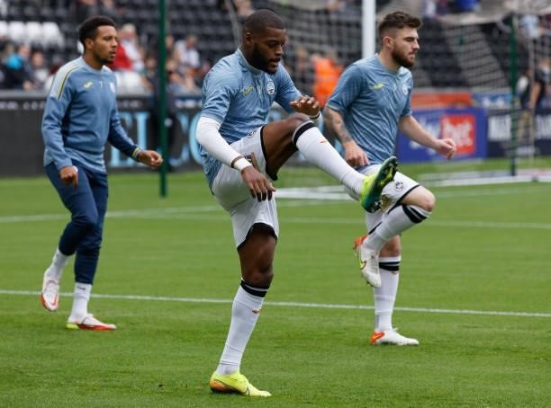 Olivier Ntcham of Swansea City warms up prior to the game during the Sky Bet Championship match between Swansea City and Huddersfield Town at the...