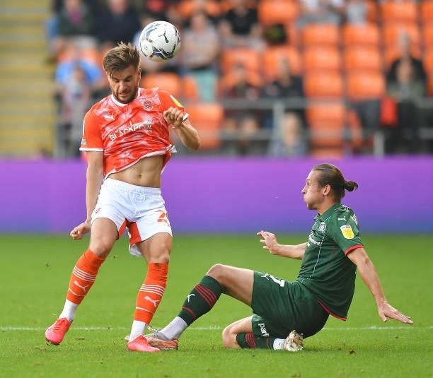 Blackpool's Luke Garbutt battles with Barnsley's Callum Brittain during the Sky Bet Championship match between Blackpool and Barnsley at Bloomfield...