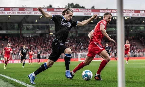 Patrick Wimmer of DSC Arminia Bielefeld in action with Marvin Friedrich of 1.FC Union Berlin during the Bundesliga match between 1. FC Union Berlin...