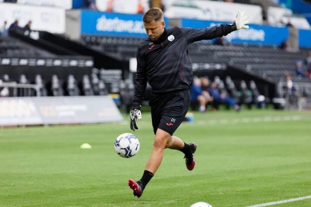Goalkeeping Coach for Swansea Dean Thornton helps his players warm up prior to the game during the Sky Bet Championship match between Swansea City...