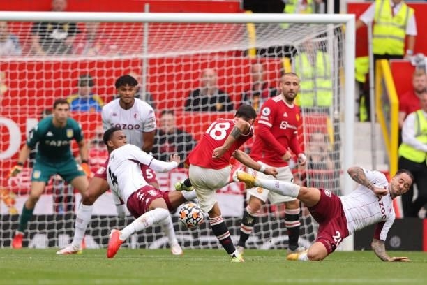 Bruno Fernandes of Manchester United has an effort blocked by the Aston Villa defence during the Premier League match between Manchester United and...