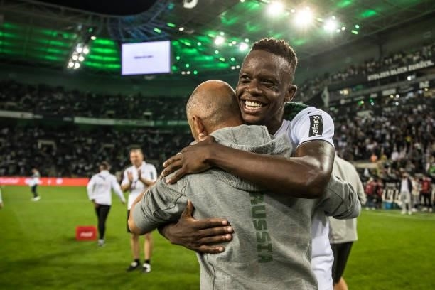 The Denis Zakaria and Oliver Neuville of Borussia Moenchengladbach celebrate after the Bundesliga match between Borussia Moenchengladbach and...