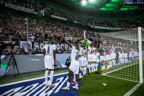 The Team of Borussia Moenchengladbach celebrate with their fans after the Bundesliga match between Borussia Moenchengladbach and Borussia Dortmund at...